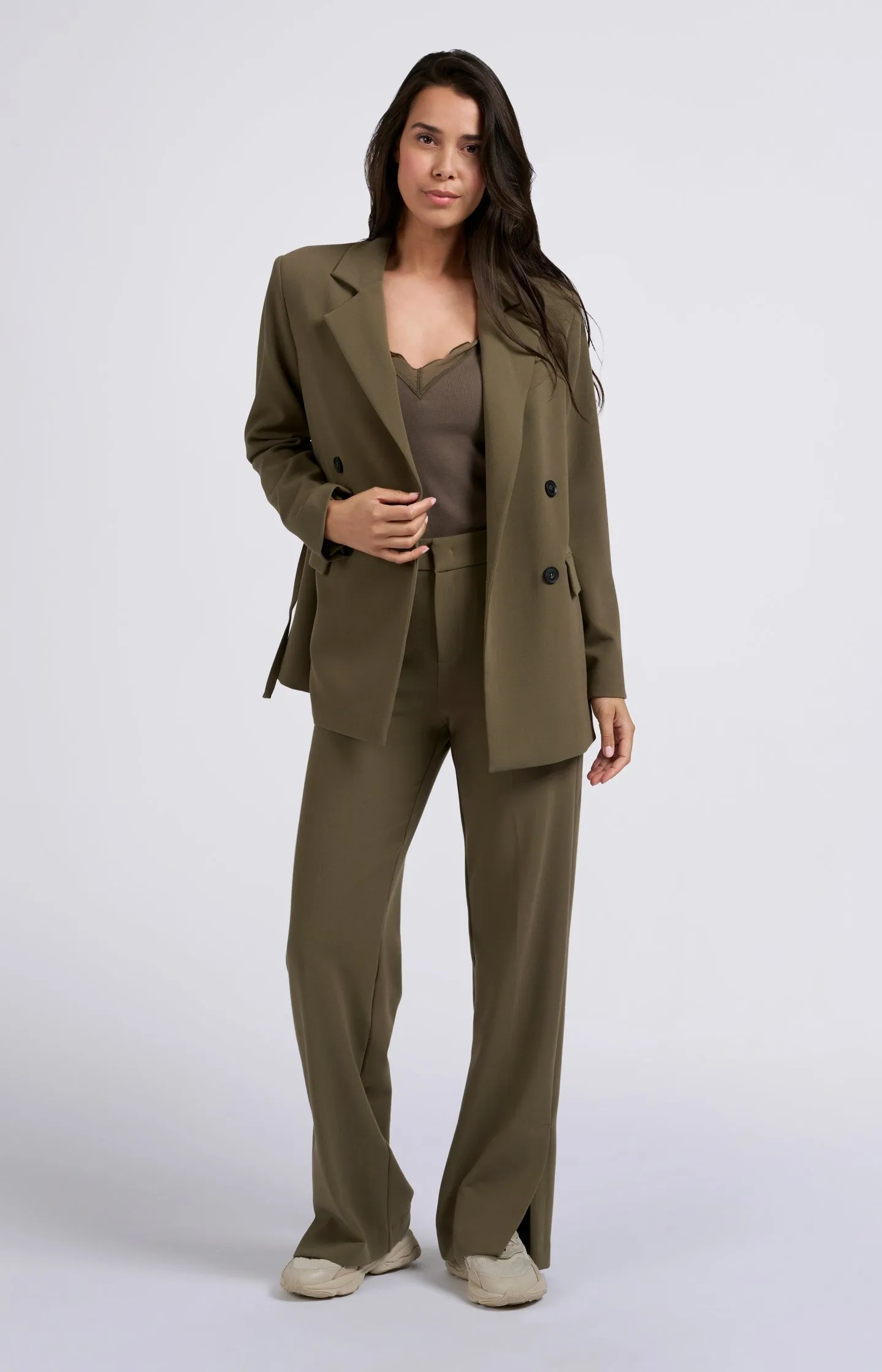 Oversized blazer with double button closure and belt detail